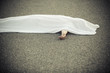 © Jan H. Andersen - Dead body covered with sheet and hand sticking out
