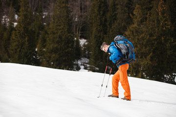 Wall Mural - Hiker in winter mountains