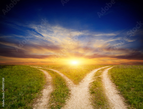 Fotografía fork roads in steppe on sunset sky background
