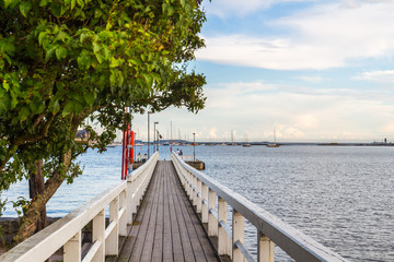 Sea pier landscape, old wooden pier and blue sky