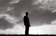 Man Standing Alone In A Field. 