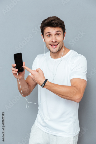 Man pointing finger at smart phone Stock Photo | Adobe Stock