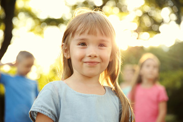 Wall Mural - Portrait of cute girl in park