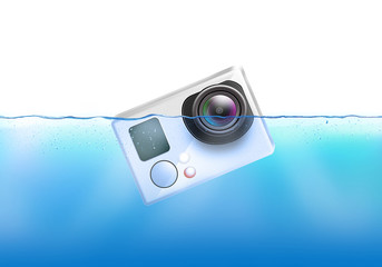 Action camera sinks in water. Action cam fall under liquid surface. Electronic recorder falling and dive. 