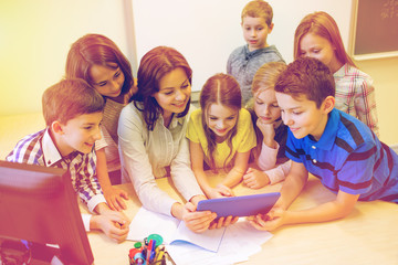 Sticker - group of kids with teacher and tablet pc at school