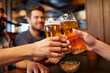 © Syda Productions - happy male friends drinking beer at bar or pub