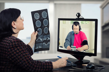 Man checks blood pressure in doctors monitor