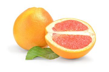 Wall Mural - Ripe Grapefruit with half and green leaf isolated on white background