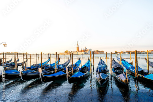 Venice landscape view on San Giorgio Maggiore island with gondolas on the foregr Poster