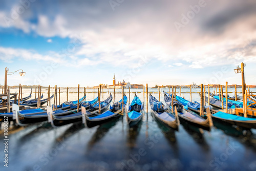 Venice landscape view on San Giorgio Maggiore island with gondolas on the foregr Poster