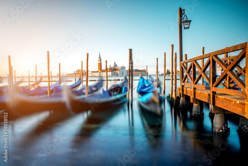 Venice landscape view on San Giorgio Maggiore island with gondolas on the foreground Poster