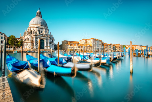 Venice cityscape view on Santa Maria della Salute basilica with gondolas on the Grand canal in Venice Poster