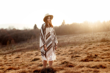 Canvas Print - beautiful boho woman hipster enjoying sunset and posing at sun l