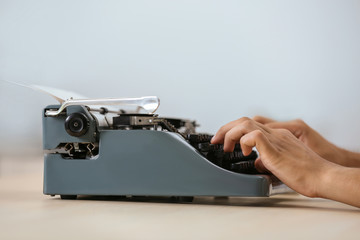 Poster - Man working on retro typewriter at desk