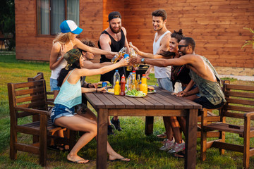 Sticker - Happy people celebrating and drinking beer at the table outdoors