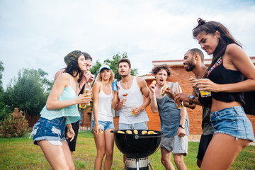 Wall Mural - Young cheerful happy teens dancing at the picnic area