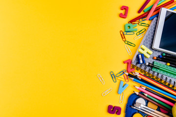 School supplies on yellow background