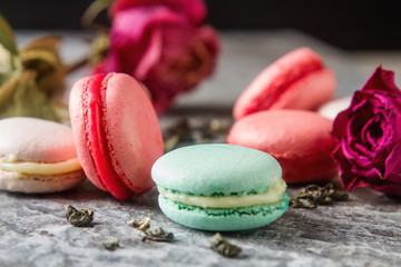 Traditional French sweets. Assorted pink, white macaroon with sp