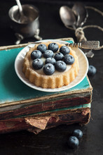 Coffee Time, Blueberries Cake Over Old Books