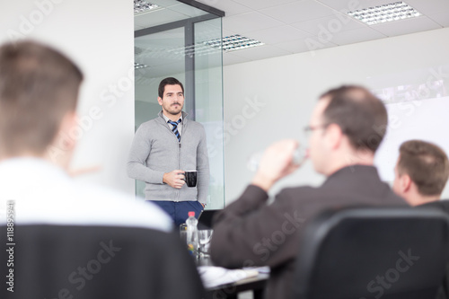 Fotografie, Obraz Relaxed cheerful team leader and business owner leading informal in-house business meeting