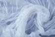 A full page of white polythene bag texture on a blue background