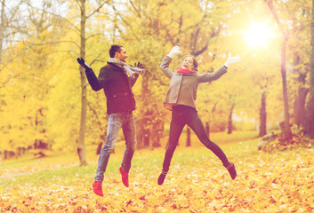 Poster - smiling couple having fun in autumn park