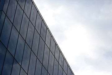 glass facade of the building against the sky