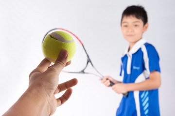 Wall Mural - Little boy playing tennis racket and tennis ball in hand