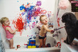 Portrait of two cute adorable white Caucasian little boy and girl playing painting cat with paints in bathroom having fun, lifestyle childhood concept