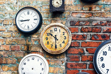 Grunge Background With Old Watch. Time Concept. Retro Clocks On The Wall. Old Antique Clock On Aged Red Brick Wall Background. Vintage Clocks.