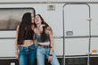 © Robert Marcillas/ADDICTIVE STOCK - Young girls hugging and sticking out tongues