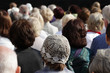 © milantefotolia - A crowd of people watching something. Composition of rhythmic adult heads.