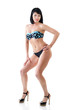 © Khorzhevska - Mid adult young fit woman posing in studio in swimsuit over whit