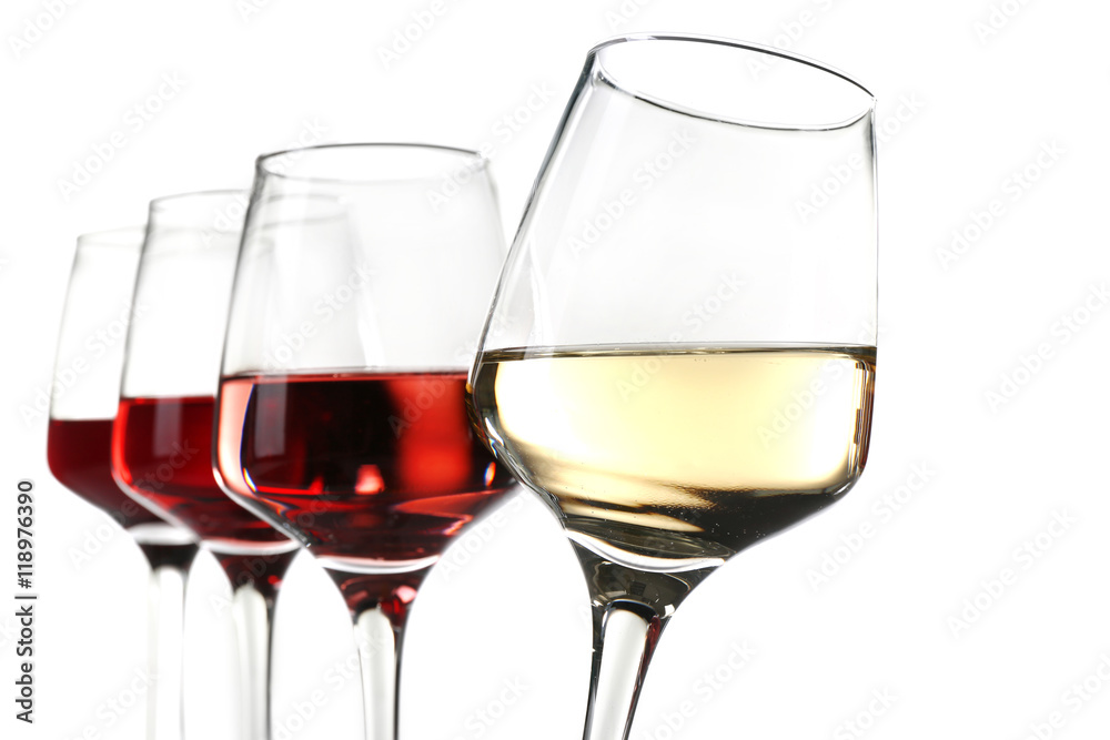 Glasses with different wine in a row, isolated on white