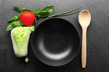 Empty plate with vegetables on table