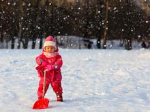 Cute Little Toddler Girl Dig Winter Snow