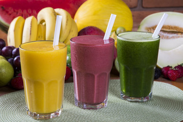 Glasses of juice with fresh fruits for summer