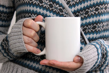 Girl In A Warm Cardigan Is Holding White Mug In Hands.