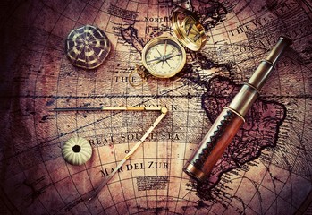 Fototapete - Old compass and telescope on vintage map. Retro style.