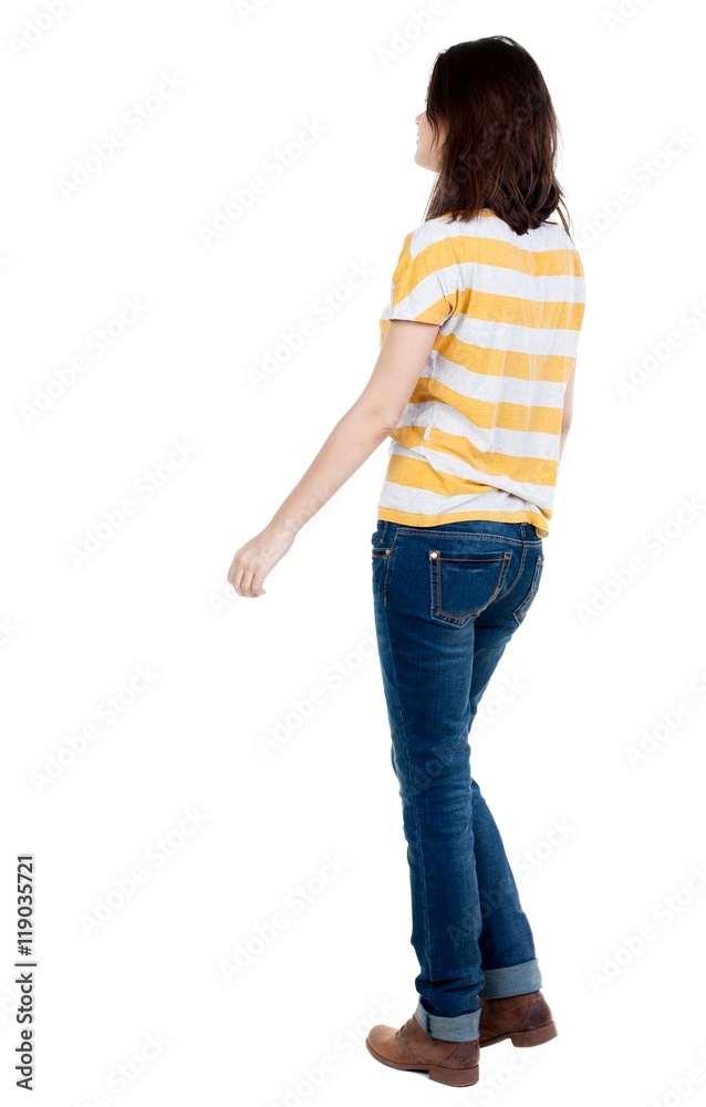 back view of walking  woman in jeans . beautiful brunette girl in motion.  backside view of person.  Rear view people collection. Isolated over white background.