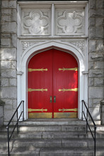 Wooden Red Church Doors With Ornate Metal Hardware