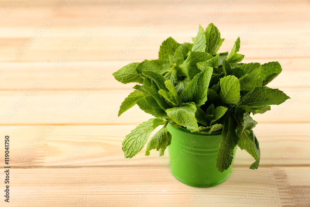 Bunch of green mint on wooden background