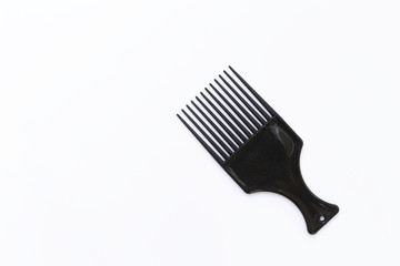 Black plastic design comb on white background