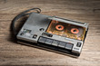old cassette tape player and recorder on old wood