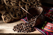 Still life photography : coffee beans from source of production at high mountain plant in northern Thailand in mini basket with handwork fabric of hill tribe