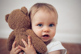 Fototapeta Las - baby with a teddy