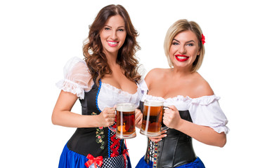 Wall Mural - Two beautiful blond and brunette girls of oktoberfest beer stein