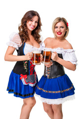 Wall Mural - Two beautiful blond and brunette girls of oktoberfest beer stein