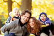 © alotofpeople - Young family in autumn park