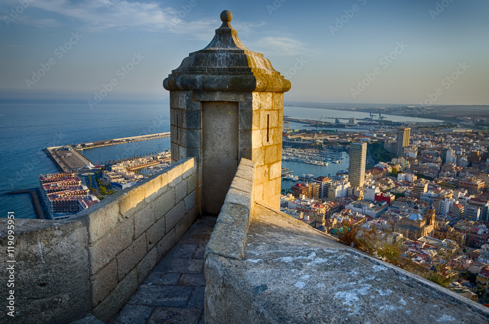 Small tower on the steep of Santa Barbara castle in sunlight, Alicante, Spain - obrazy, fototapety, plakaty 